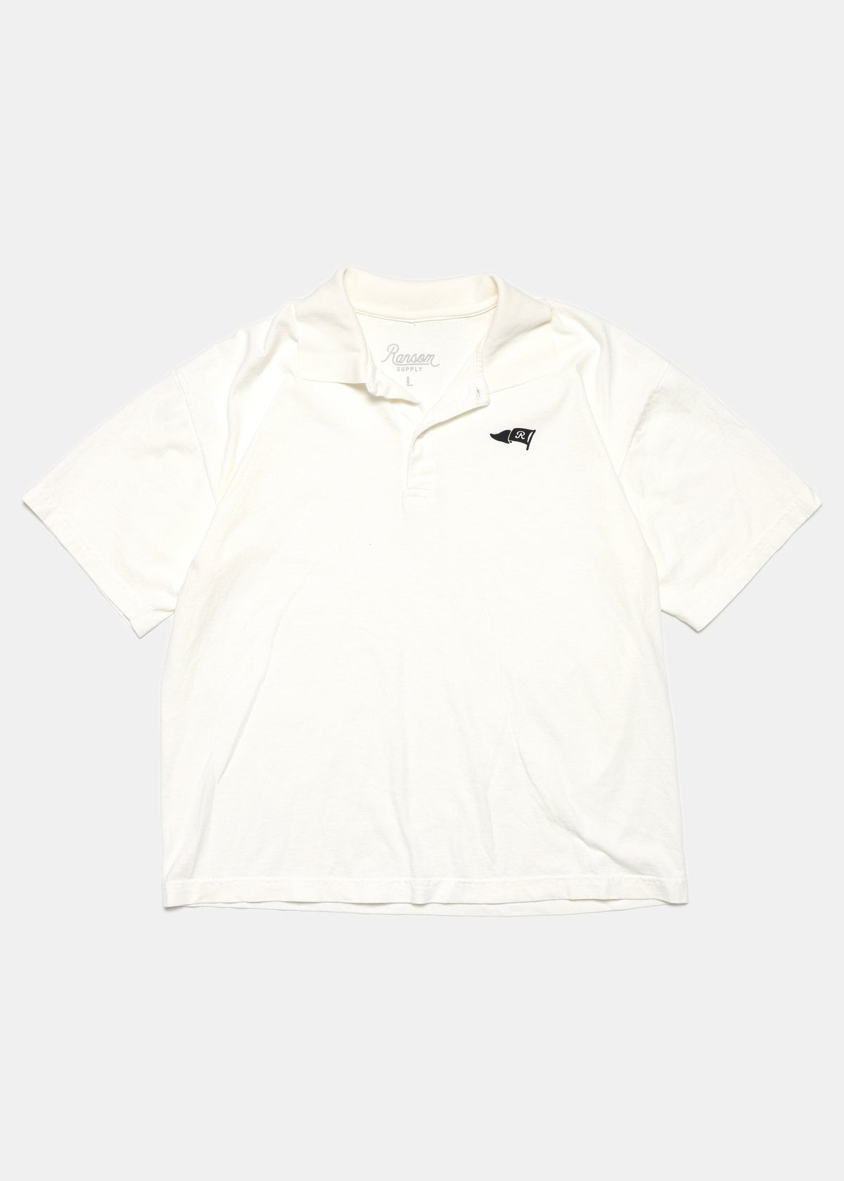 R Flag polo in off white by Ransom Supply, front