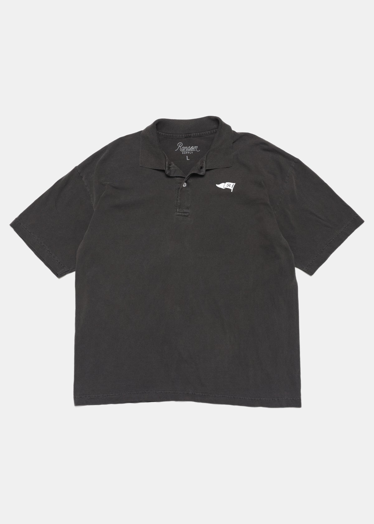 R Flag polo in vintage black by Ransom Supply, front
